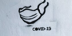 Ein Grafitti einer Mund-Nasen-Bedeckung